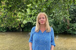 Liz standing in river