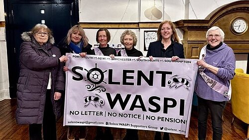 Liz standing with group of WASPI campaigners